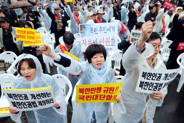 South Korean protestors shout slogans during a rally against North Korea's regime in Seoul on April 26. The placards read 'Freedom and human rights for North Korean people.' (Ji-Hwan/AFP/Getty Images)